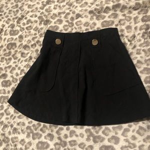 Super cute black skirt with gold accents